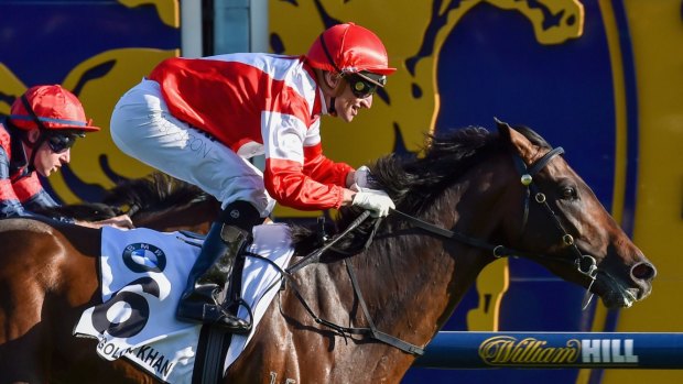 Cup hero: Opie Bosson takes out the Caulfield Cup on Mongolian Khan. 