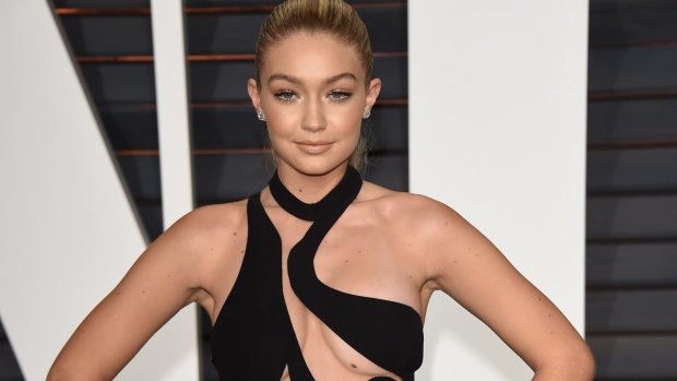 Gigi Hadid attends the Vanity Fair Oscar party in her barely there dress by Versace.