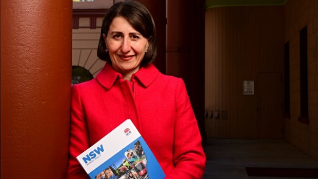 State Treasurer Gladys Berejiklian with the 2016-17 budget papers outside State Parliament on Monday.