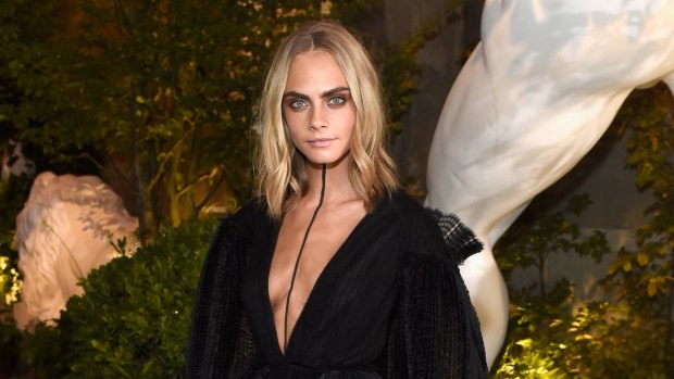 Cara Delevingne wearing Burberry at the Burberry September 2016 show during London Fashion Week SS17 at Makers House on September 19, 2016 in London, England.