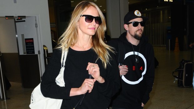 Benji Madden collects his wife Cameron Diaz from the Sydney Airport on Saturday.
