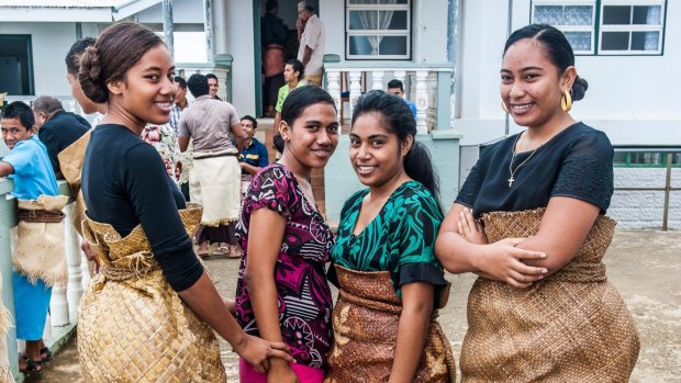 Traditional dressed Tongan women at a church service.
