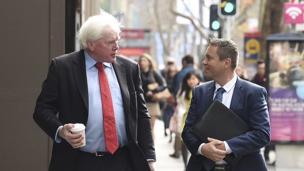 Anthony Andjic (right) talks with his lawyer as they arrive at an ICAC hearing.