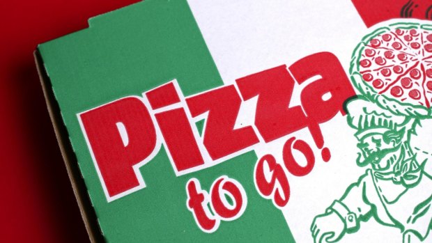 A man is charged with robbing two Gold Coast pizza delivery drivers a month apart.