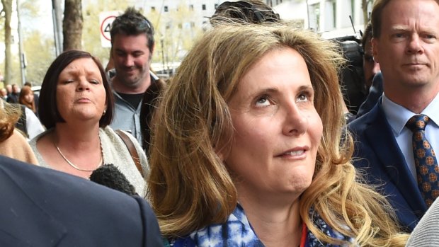 Kathy Jackson rolls her eyes as she is yelled at outside Melbourne Magistrates Court.  