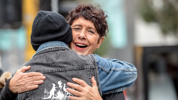 Boon Wurrung elder Carolyn Briggs embraces activist Robbie Thorpe at the ceremony. 