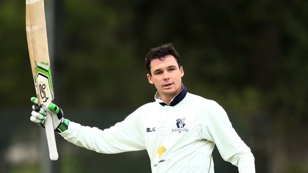 Peter Handscomb celebrates a century in this year's Sheffield Shield final.