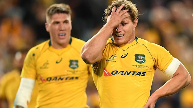 Tough night: Skipper Michael Hooper reacts to another All Blacks try.