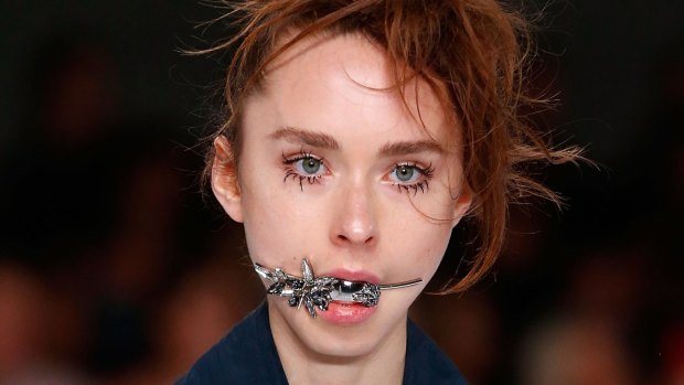 Odd-ball jewellery: A model walks the runway for Toni Maticevski's Resort17 Collections.