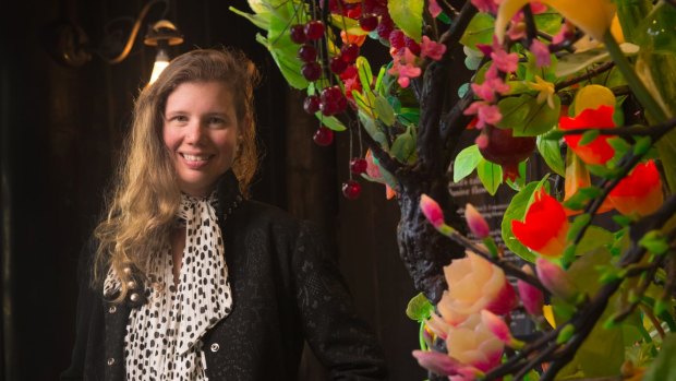 Artist Kate Rohde with her floral installation at Heronswood.