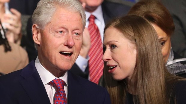 Former president Bill Clinton and his daughter Chelsea Clinton in the debate audiece.