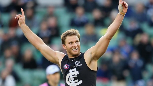 Former Carlton player Lachie Henderson celebrates a goal.  