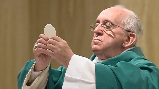Pope Francis celebrates Mass at the Vatican's Santa Marta hotel on Monday.