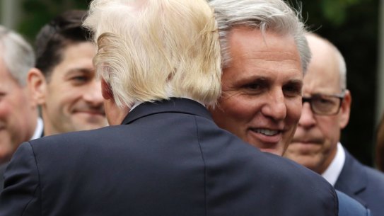 President Donald Trump hugs House Majority Leader Kevin McCarthy of  in the Rose Garden of the White House in Washington, on May 4. 