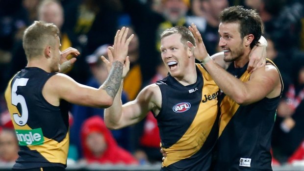 Hot and cold: Jack Riewoldt and Ivan Maric of the Tigers celebrate.