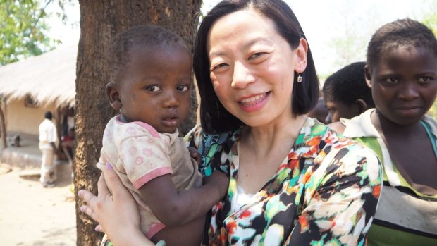 Ailan Tran with baby Mary in Malawi.
