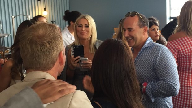 Maguire taking pictures of Woodgate and friends in the Alfa Romeo marquee on Saturday.