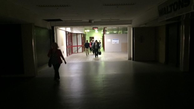 Commuters walking through the dark into Fortitude Valley train station on Tuesday.