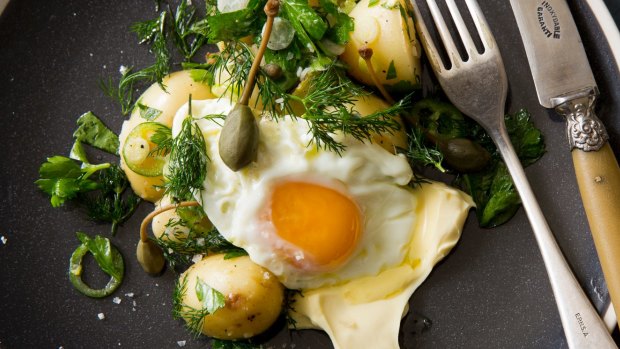 Karen Martini Soured Cream Recipes. Vinaigrette potatoes with cornichons, caperberries, dill, creme fraiche and fried egg. Pictures by Marcel Aucar. Styling by Caroline Velik. To be used in upcoming Epicure/Good Food recipe spread.
