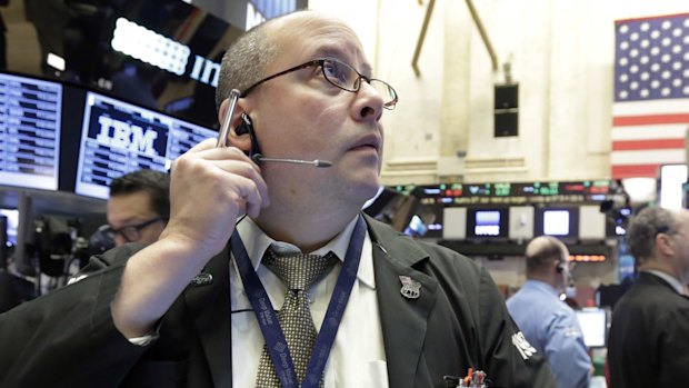 Trader Jeffrey Vazquez works on the floor of the New York Stock Exchange.