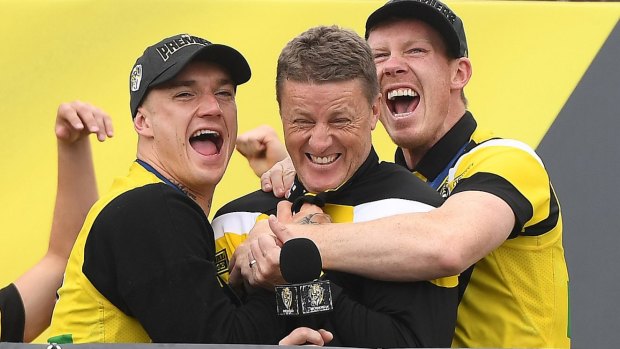 Dustin Martin (left), Hardwick and Jack Riewoldt on stage on Sunday.