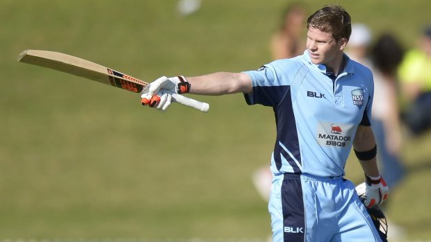 Ton up: Steve Smith celebrates after reaching his century on Friday