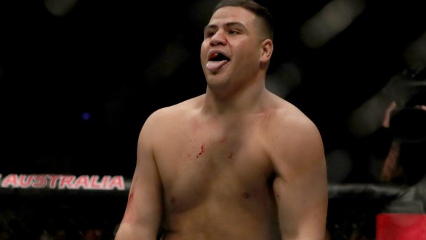 Working up a thirst: Tai Tuivasa celebrates winning against Cyril Asker from France.