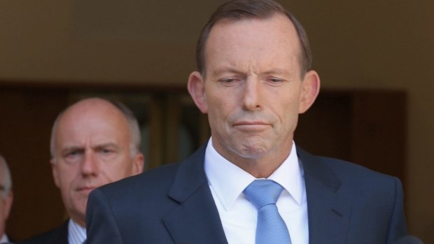 Seeking an election trigger? Prime Minister Tony Abbott with senators Eric Abetz and George Brandis. 