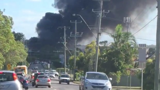 Thick smoke rising from the Acacia Ridge fire was visible from the Brisbane CBD, about 15 kilometres away.