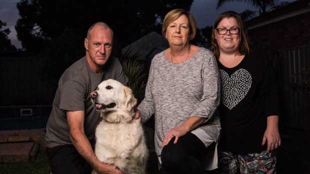 Ken and Diane Barrow, with their daughter Lauren and labrador Mia, hope the royal commission will bring some accountability.