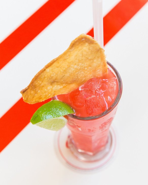 Jesus Maria - watermelon and mezcal garnished with chicken skin crackling and lime.