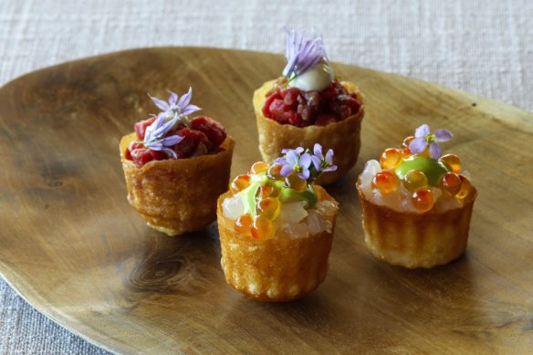 Pie tee shells of carrot waste filled with delicately smoked salmon.