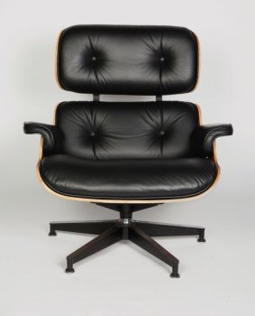 A replica Eames lounge chair.