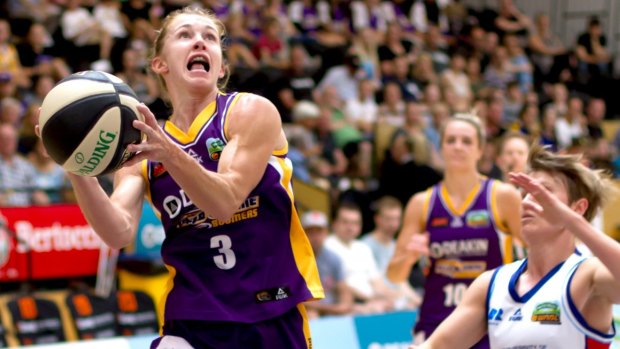 Melbourne Boomers' Brittany Smart drives to the hoop against Canberra's Jess Bibby.