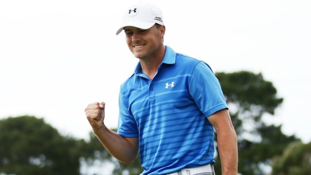 Champion: Jordan Spieth celebrates after putting on the 18th hole and winning the 2014 Australian Open.