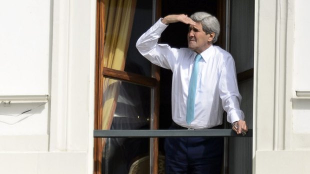 Searching for a deal: US Secretary of State John Kerry looks out from his Swiss hotel room. 