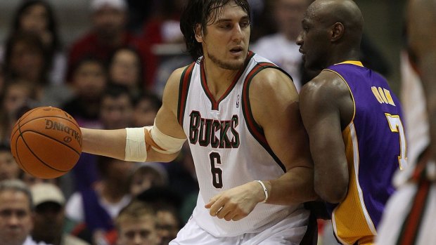 Head to head: Andrew Bogut, playing for the Milwaukee Bucks in 2010, moves against Lamar Odom of the Los Angeles Lakers.