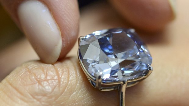 The rare Blue Moon diamond. The 12.03 carat blue diamond is the largest cushion shaped fancy vivid blue diamond  ever appear at auction.