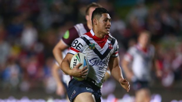 On the fly: Roger Tuivasa-Sheck makes a break for the Roosters in their crushing win over Manly.