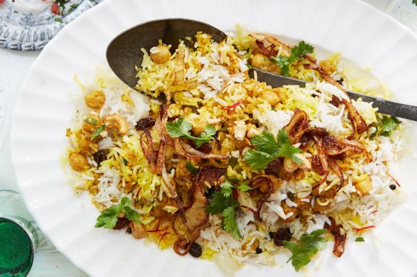 Chickpea biryani topped with crispy onions and cashews.