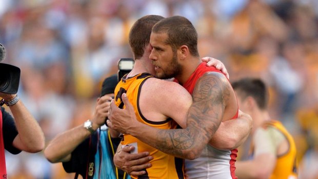 Jarryd Roughead embraces his friend and former teammate Lance Franklin after the 2014 grand final