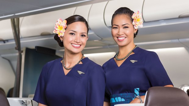 The smiling cabin staff, complete with flowers behind their ears, hand out maps of the island you're on your way to.