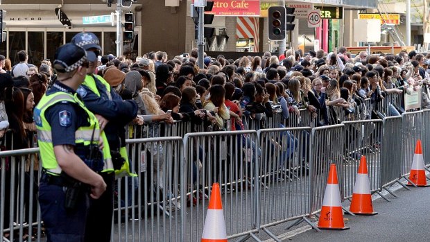 Crowds gather near the movie set during the final day of filming in Brisbane.