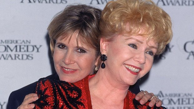 Carrie Fisher hugging her mother, Debbie Reynolds.