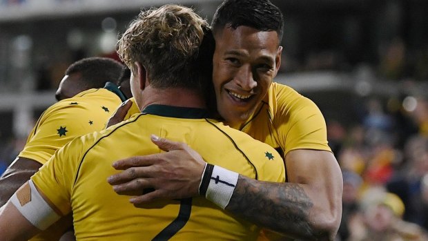On record pace: Israel Folau celebrates after scoring a try against Argentina, one of 11 so far this year.