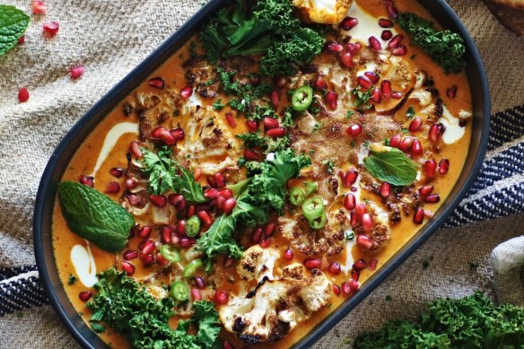 Cauliflower steaks swimming in coconut saffron curry.