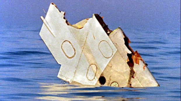 A piece of debris from TWA flight 800 floats on July 18, 1996, in the Atlantic Ocean off Long Island.