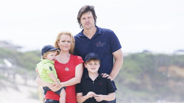 Battle over insurance: Former test cricket player Nathan Bracken with his wife Haley and boys Chase and Tag.