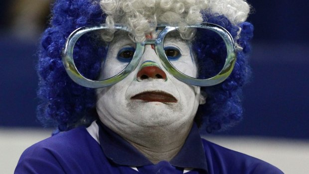 An El Salvador fan watches his team during a 2018 World Cup qualifying soccer match against Honduras on Friday.