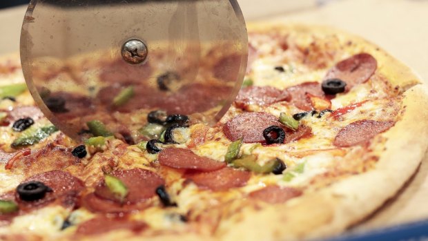 Domino's Pizza has been accused of taking a large slice out of franchisee profits.